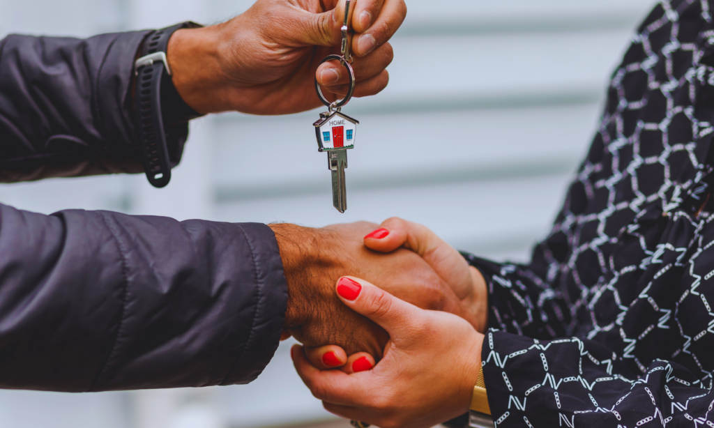 A homebuyer receiving keys